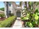 Landscaped front entrance with garden beds, shrubs, and a walkway leading to the front door at 5915 43Rd E Ct, Bradenton, FL 34203