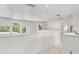 Bright hallway featuring neutral walls, white trim, large windows and an open concept design at 5915 43Rd E Ct, Bradenton, FL 34203