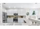 Spacious kitchen offers stainless appliances, ample cabinets, and modern backsplash at 5915 43Rd E Ct, Bradenton, FL 34203