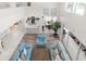 Elevated view of the living room showcasing the open floor plan, kitchen access and natural light at 5915 43Rd E Ct, Bradenton, FL 34203