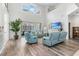 Bright living room with high ceilings, neutral decor, and a seamless connection to the outdoor screened lanai at 5915 43Rd E Ct, Bradenton, FL 34203