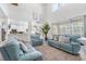 Airy living room with high ceilings and open layout, blending seamlessly with the kitchen and dining areas at 5915 43Rd E Ct, Bradenton, FL 34203
