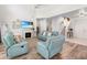 Bright and airy living room features high ceilings, a fireplace, and comfortable seating at 5915 43Rd E Ct, Bradenton, FL 34203