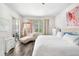Tranquil main bedroom featuring a chaise lounge and a private balcony at 5915 43Rd E Ct, Bradenton, FL 34203