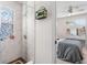 Ensuite shower stall featuring decorative tile, a rainfall showerhead, and a small window with stained glass at 5915 43Rd E Ct, Bradenton, FL 34203