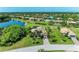 Wide aerial shot displaying a single-Gathering home with pristine landscaping and picturesque neighborhood at 618 148Th Ne Ct, Bradenton, FL 34212
