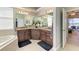 Bathroom featuring a double vanity with granite countertops and dark wood cabinetry at 618 148Th Ne Ct, Bradenton, FL 34212