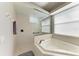 Bright bathroom with a corner bathtub and glass-enclosed shower at 618 148Th Ne Ct, Bradenton, FL 34212