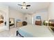 Well-lit bedroom with a king-sized bed, dresser, and relaxing decor at 618 148Th Ne Ct, Bradenton, FL 34212