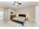 Serene bedroom featuring a king-sized bed, side tables, and ample space at 618 148Th Ne Ct, Bradenton, FL 34212