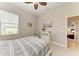 Cozy bedroom featuring a bed, natural light, and contemporary decor at 618 148Th Ne Ct, Bradenton, FL 34212