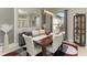 Formal dining room featuring a wooden table with seating for six and stylish decor at 618 148Th Ne Ct, Bradenton, FL 34212