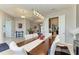 Bright dining room showcasing an elegant table and stylish lighting, complemented by an open floor plan at 618 148Th Ne Ct, Bradenton, FL 34212