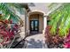 Welcoming front entrance featuring a stylish door and beautifully landscaped surroundings at 618 148Th Ne Ct, Bradenton, FL 34212