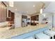 Kitchen with bar seating, stainless steel appliances, and dark wood cabinetry at 618 148Th Ne Ct, Bradenton, FL 34212