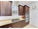 Kitchen featuring a cooktop, stainless hood, granite counters, and stainless oven at 618 148Th Ne Ct, Bradenton, FL 34212