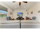 Spacious living room with neutral walls, recliner chairs, and a large television for entertainment at 618 148Th Ne Ct, Bradenton, FL 34212