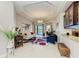 Bright living room with modern decor, open floor plan, and pool view at 618 148Th Ne Ct, Bradenton, FL 34212