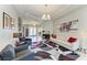 Elegant living room featuring stylish furniture, modern decor, and ample natural light at 618 148Th Ne Ct, Bradenton, FL 34212