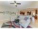 Open living room showcasing a comfortable sectional sofa and seamless flow to the kitchen at 618 148Th Ne Ct, Bradenton, FL 34212