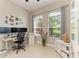 Well-lit home office space with large windows and neutral decor at 618 148Th Ne Ct, Bradenton, FL 34212