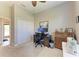 Spacious home office with a desk, sewing machine and closet at 618 148Th Ne Ct, Bradenton, FL 34212