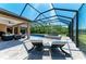 Screened-in pool and spa with an inviting outdoor living area at 618 148Th Ne Ct, Bradenton, FL 34212