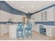 Bright kitchen with breakfast bar, modern appliances, and ample cabinet space offers modern convenience at 6442 Tailfeather Way, Bradenton, FL 34203