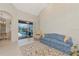 Spacious living room with vaulted ceilings and access to the pool area offering seamless indoor-outdoor living at 6442 Tailfeather Way, Bradenton, FL 34203