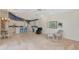 Spacious living space combining kitchen, dining, and seating areas creates a welcoming and functional layout at 6442 Tailfeather Way, Bradenton, FL 34203