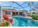 Sparkling pool and spa area with screened enclosure at 6442 Tailfeather Way, Bradenton, FL 34203