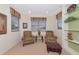 Cozy sitting area with comfortable armchairs, a small side table, and decorative accents at 6442 Tailfeather Way, Bradenton, FL 34203