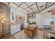 Bright home office with custom cabinetry and a brick accent wall at 6600 Horned Owl Pl, Sarasota, FL 34241