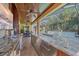 Long outdoor kitchen bar with granite countertops, sink, and storage at 6600 Horned Owl Pl, Sarasota, FL 34241