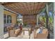 Cozy outdoor patio with comfortable seating and a fire pit, perfect for entertaining and enjoying the outdoors at 6600 Horned Owl Pl, Sarasota, FL 34241