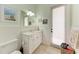 Bathroom featuring vanity and toilet with a beach-themed decor at 7913 Osprey Hammock Ct, Sarasota, FL 34240