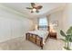 Relaxing bedroom with a ceiling fan and two side tables, plus decor art at 7913 Osprey Hammock Ct, Sarasota, FL 34240