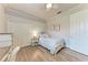 Bright bedroom featuring a ceiling fan, closet, and a cozy bed with elegant details at 7913 Osprey Hammock Ct, Sarasota, FL 34240