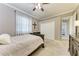 Bedroom with a dark wood frame bed, closet and view into hallway at 7913 Osprey Hammock Ct, Sarasota, FL 34240