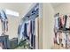 Walk-in closet providing ample storage with shelving and hanging space for clothes at 7913 Osprey Hammock Ct, Sarasota, FL 34240