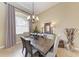 Spacious dining room featuring a wooden table, chandelier, and neutral accents at 7913 Osprey Hammock Ct, Sarasota, FL 34240