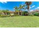 Beautiful one-story home with lush landscaping and a well-manicured lawn in a desirable neighborhood at 7913 Osprey Hammock Ct, Sarasota, FL 34240