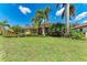 Beautiful one-story home with lush landscaping and a well-manicured lawn in a desirable neighborhood at 7913 Osprey Hammock Ct, Sarasota, FL 34240