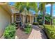 Inviting front entrance with stone walkway and lush landscaping for great curb appeal at 7913 Osprey Hammock Ct, Sarasota, FL 34240