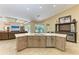 Open kitchen layout with a large island, stainless steel appliances and open views to the living space at 7913 Osprey Hammock Ct, Sarasota, FL 34240