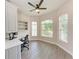 Bright office space featuring built-in shelves and a large window providing natural light at 7913 Osprey Hammock Ct, Sarasota, FL 34240