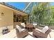 Outdoor patio with seating area, bar, grill, and ceiling fan at 7913 Osprey Hammock Ct, Sarasota, FL 34240
