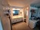 Bright bathroom featuring a large vanity, sink, mirror, and an adjacent workstation at 808 53Rd E Ave # 234, Bradenton, FL 34203
