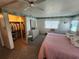 Bedroom featuring a closet and an ensuite vanity with an adjacent stool and mirror at 808 53Rd E Ave # 234, Bradenton, FL 34203