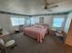 Bright bedroom with a ceiling fan, two windows, and coordinated furniture at 808 53Rd E Ave # 234, Bradenton, FL 34203